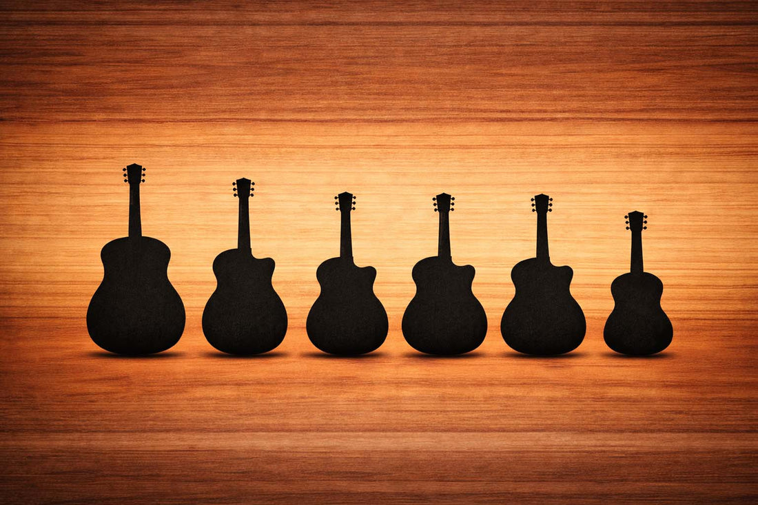 Silhouettes of common acoustic guitar body shapes on a wooden background