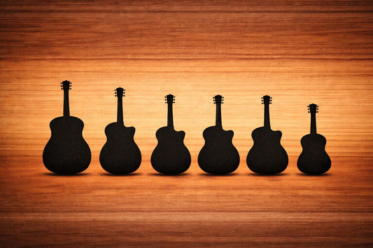 Silhouettes of common acoustic guitar body shapes on a wooden background